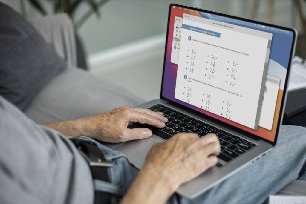 Men working on a laptop with productivity tools